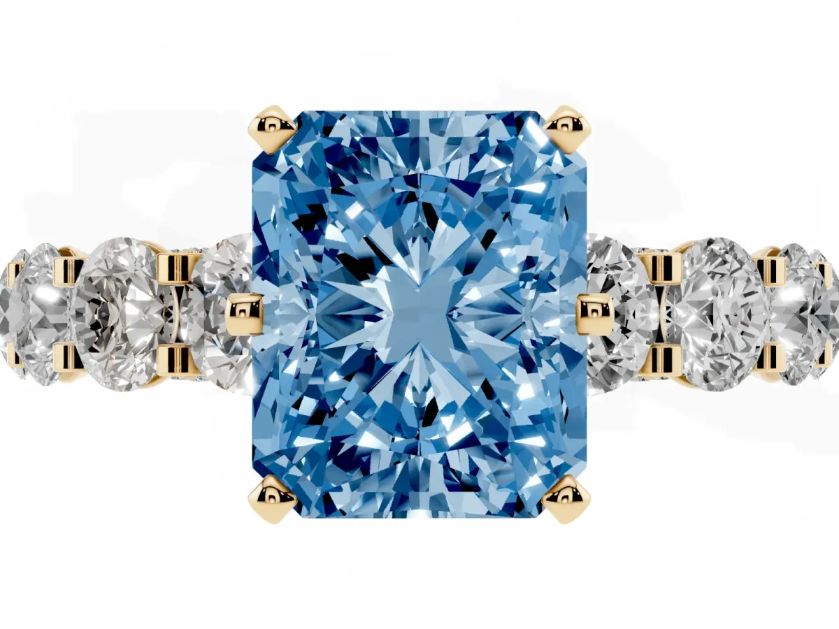 Fancy Blue Radiant Cut Diamond Side Stone Engagement Ring with Four-Prong Setting Yellow gold
