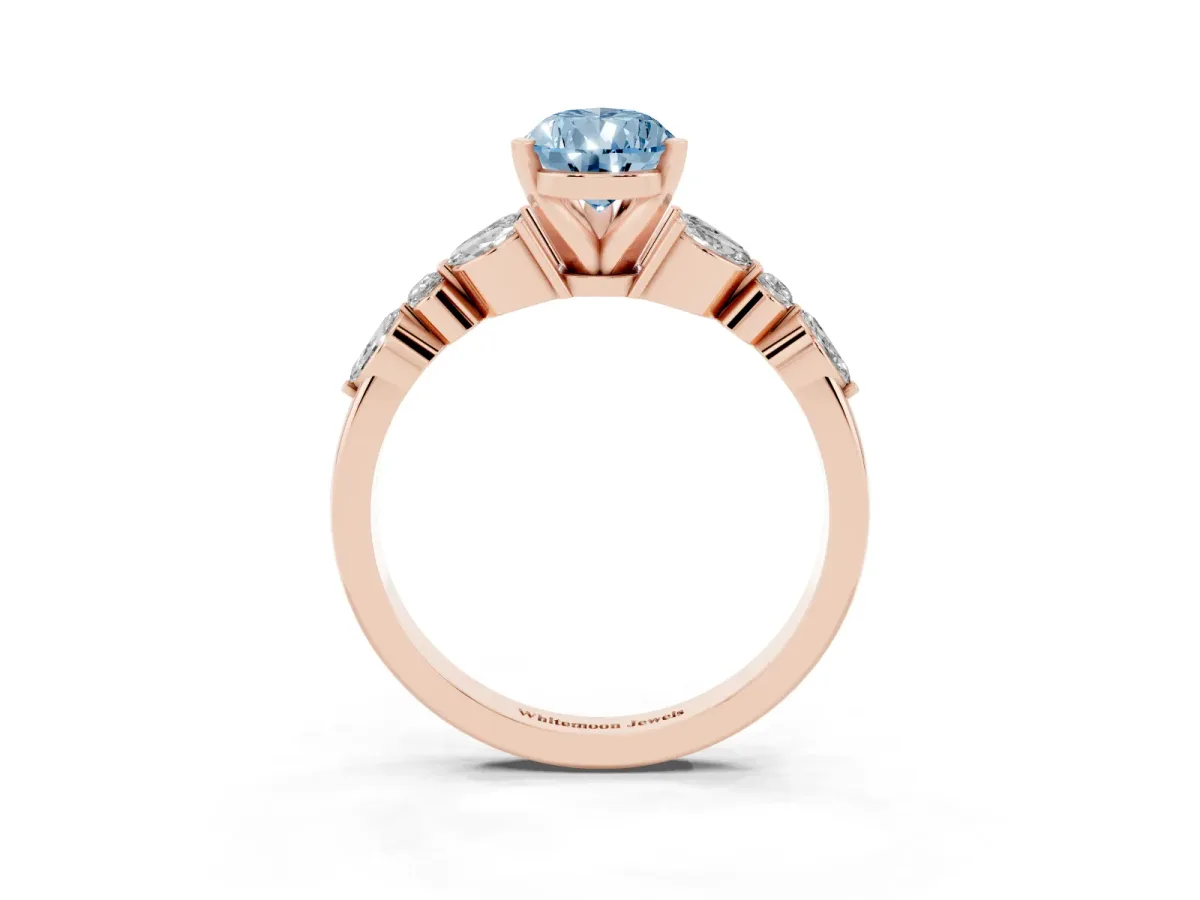 Fancy Blue Pear Cut Diamond Solitaire Ring with Side Stones and Four-Prong Setting Rose gold