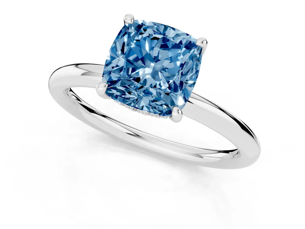 Fancy Blue Cushion Cut Diamond Solitaire Ring with Thin Band and Four-Prong Setting Platinum