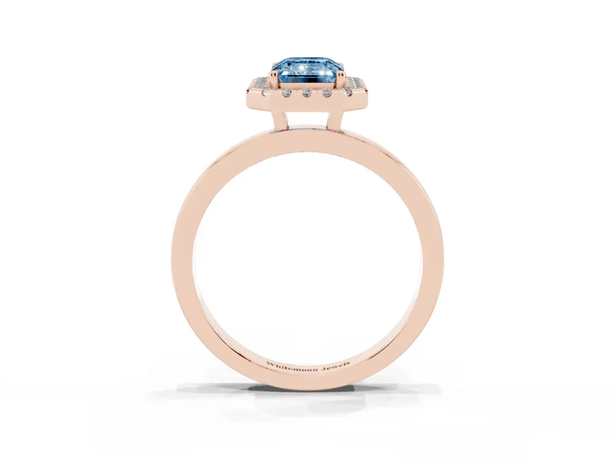 Fancy Blue Emerald Cut Halo Diamond Solitaire with Pavé Band and Four-Prong Setting Rose gold