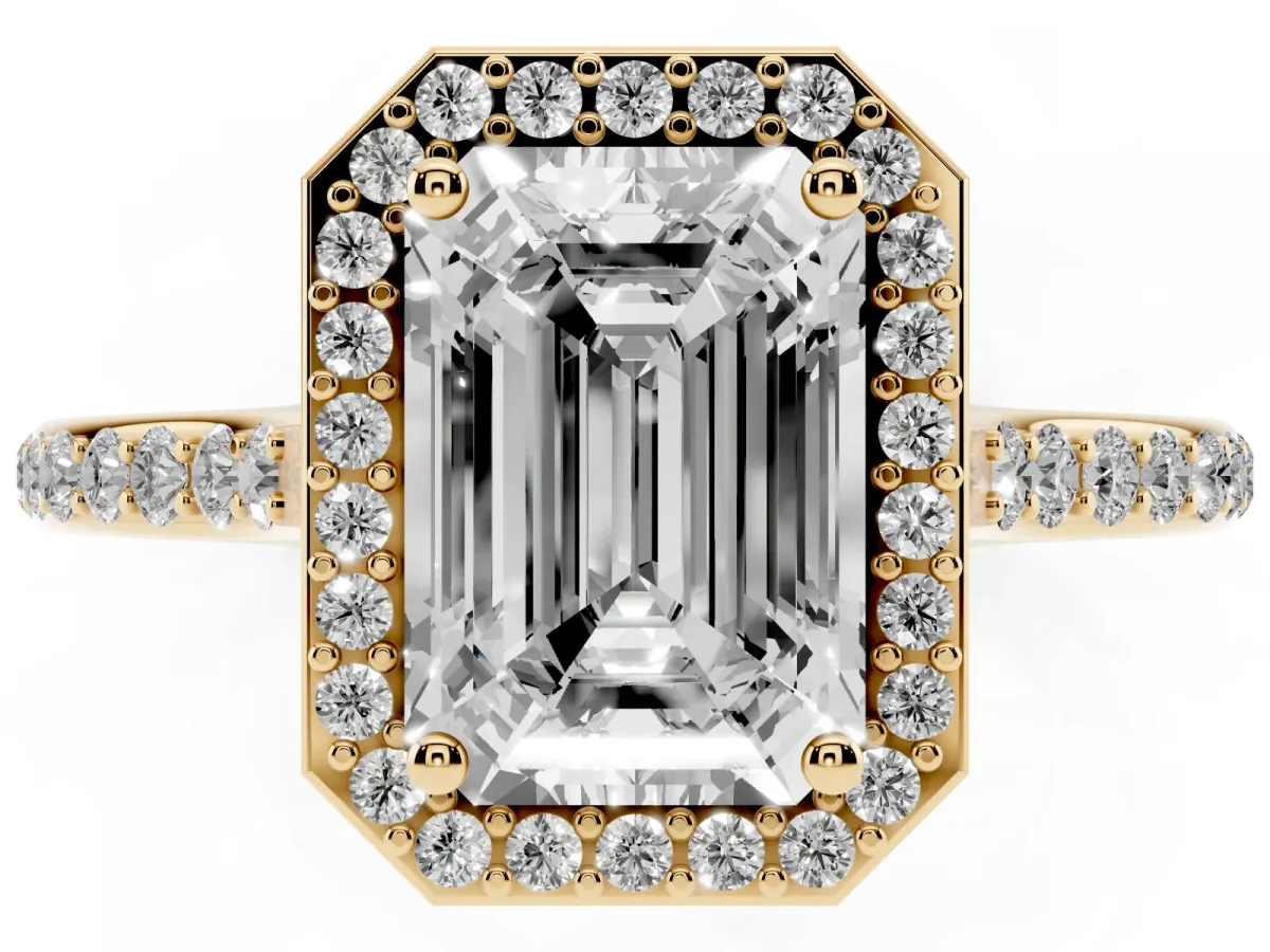 Emerald Cut Diamond Halo Engagement Ring with Round Pavé Shoulders and Prong Setting Yellow gold