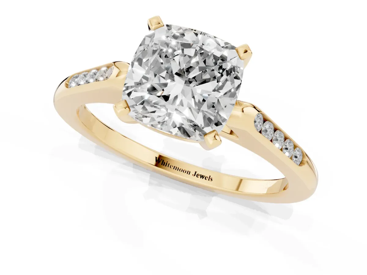 Cushion Cut Diamond Solitaire Ring with Channel Set Round Band and Prong Setting Yellow gold