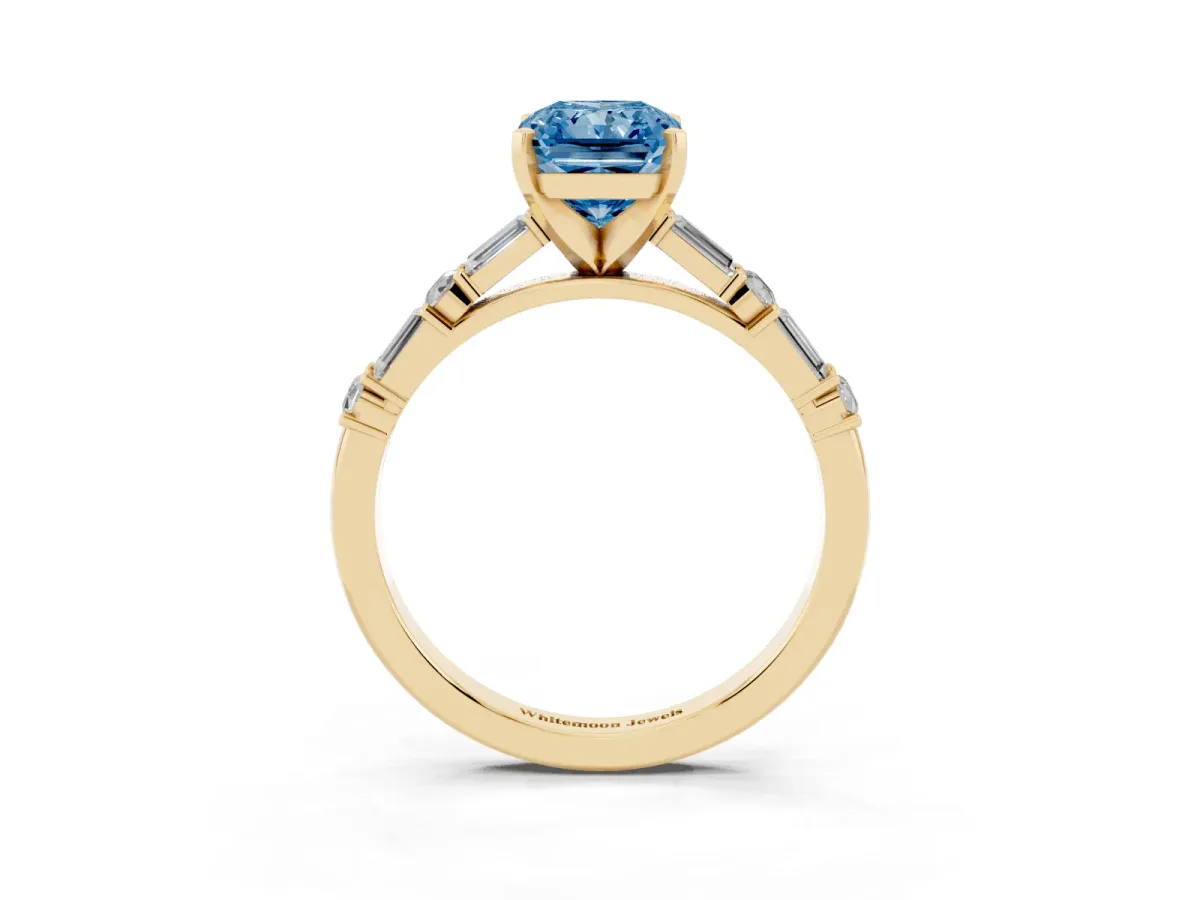 Fancy Blue Radiant Cut Diamond Solitaire with Side Baguettes and Channel Set Band Yellow gold