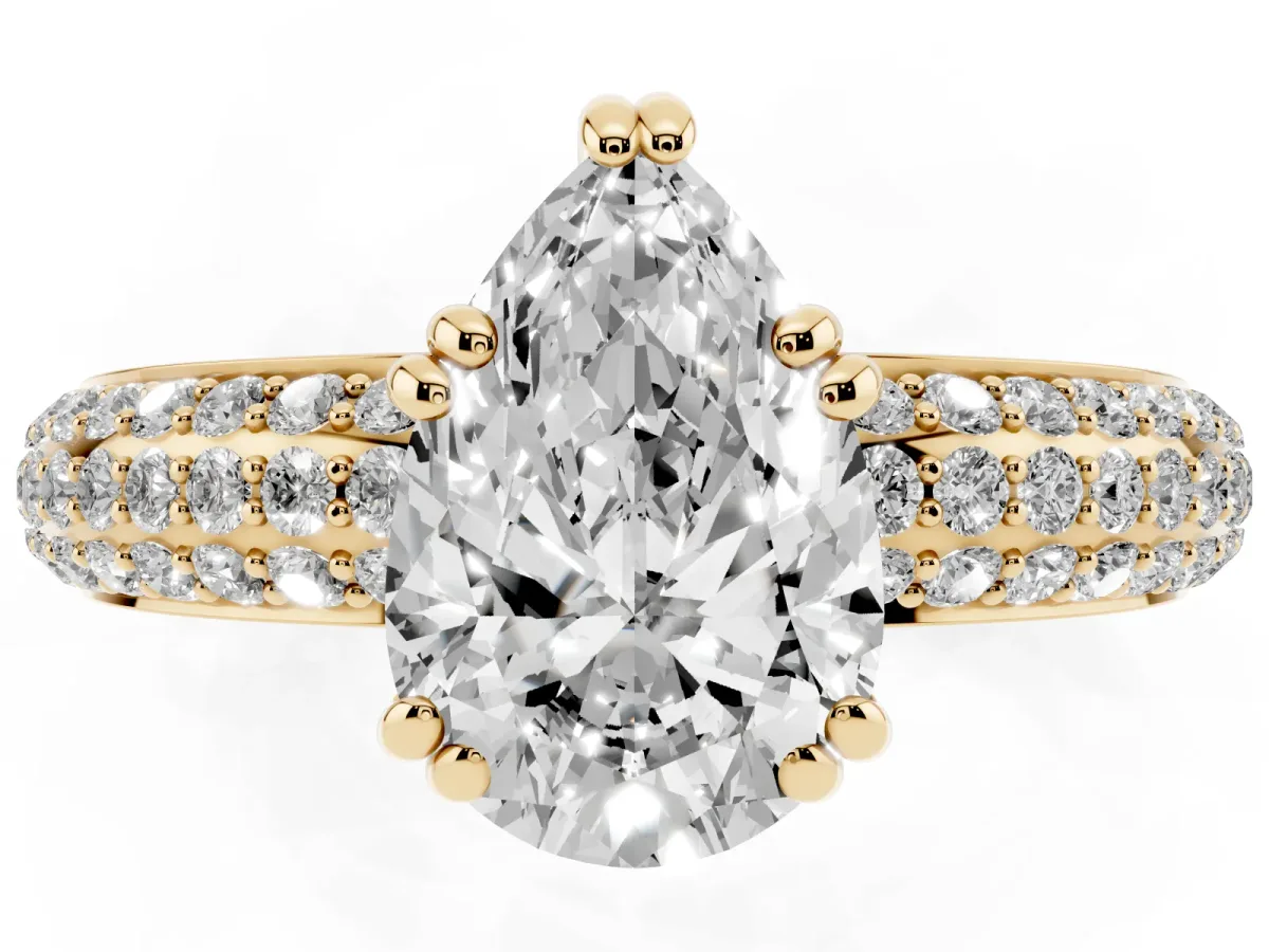 Pear Cut Diamond Solitaire Ring with Multi-Row Round Pavé Band and Prong Setting Yellow gold