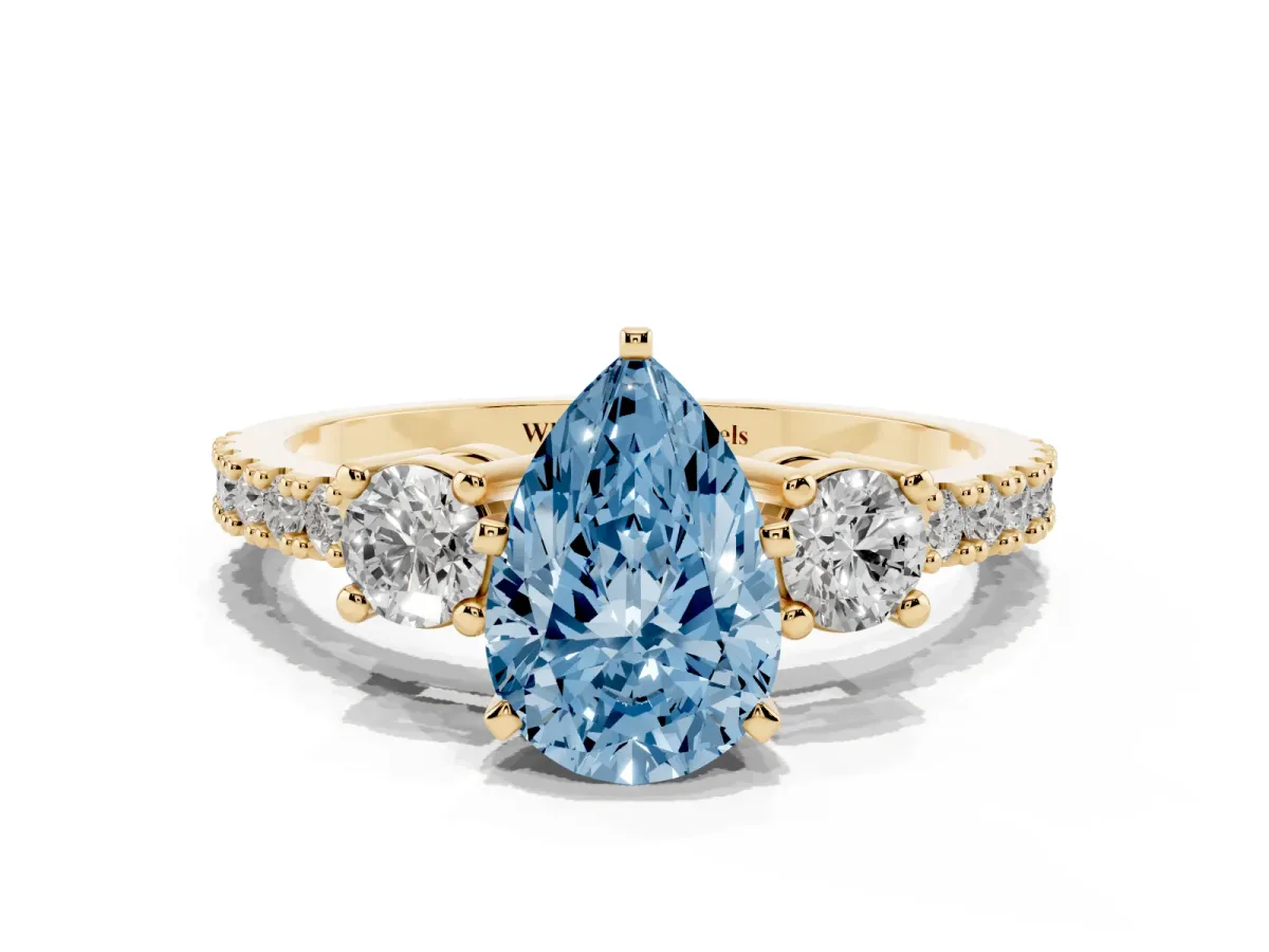 Fancy Blue Pear Cut Three-Stone Diamond Pavé Band with Prong Setting Yellow gold