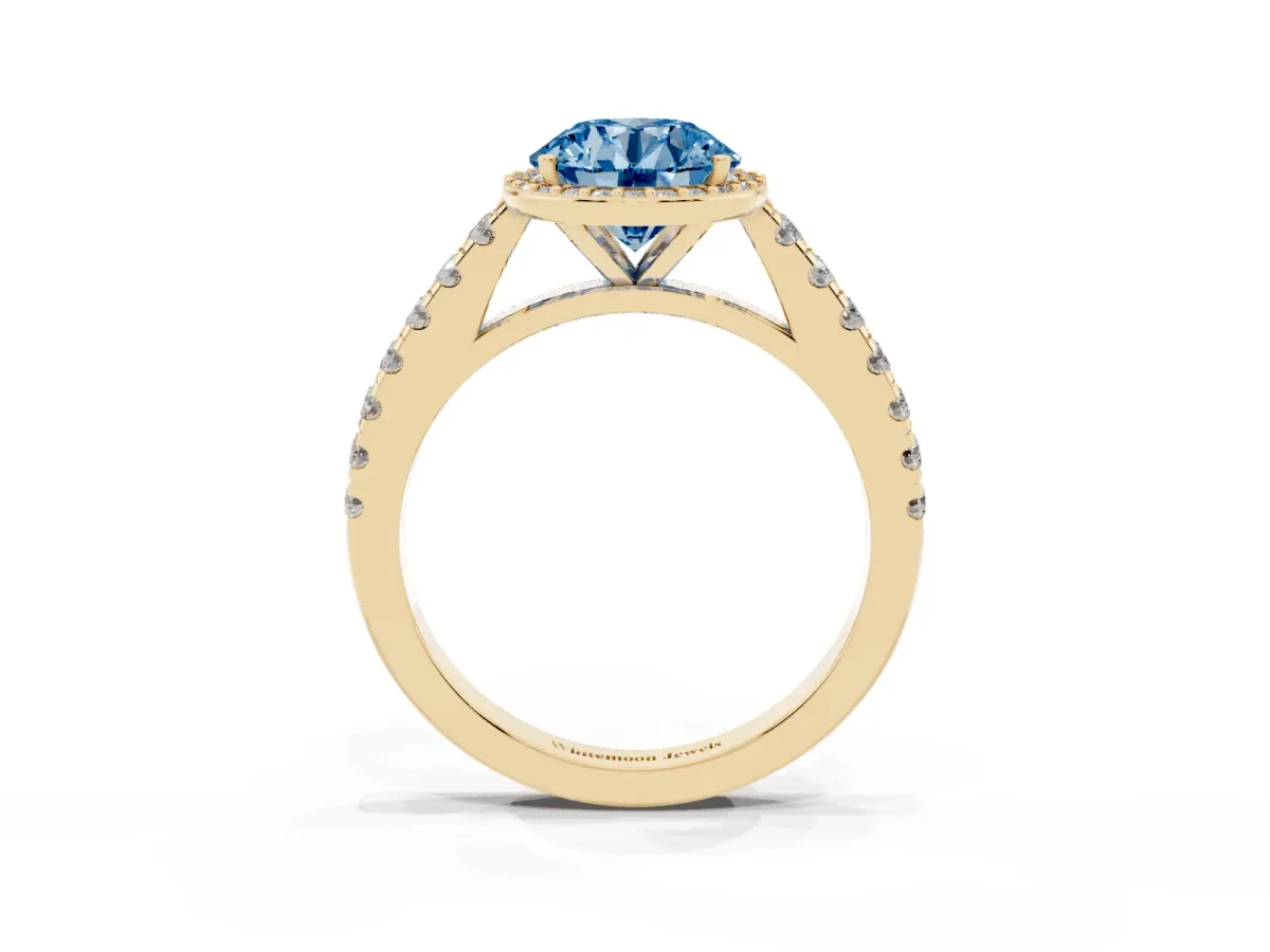Fancy Blue Round Cut Cut Halo Diamond Engagement Ring with Pave Band and Four-Prong Setting Yellow gold