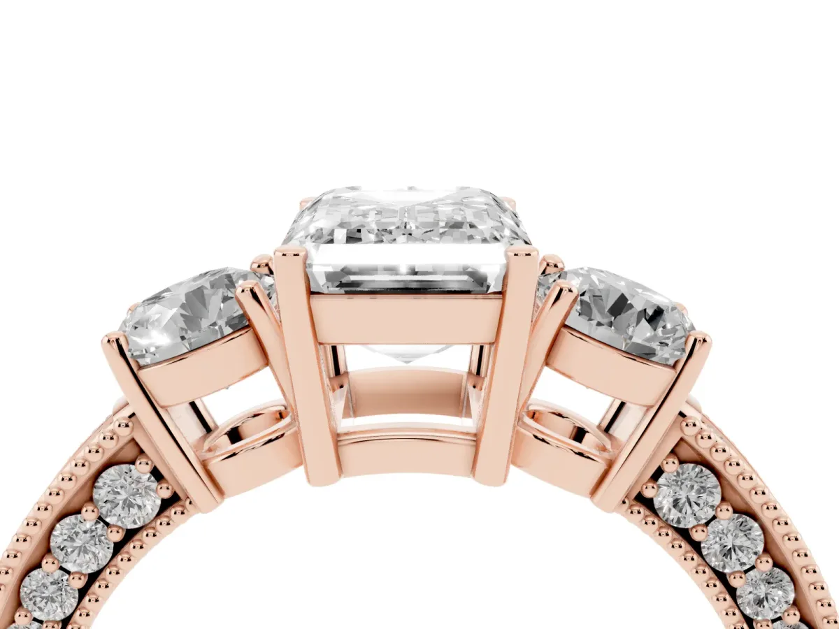 Emerald Cut Three-Stone Diamond Ring with Pavé Band and Four-Prong Setting Rose gold