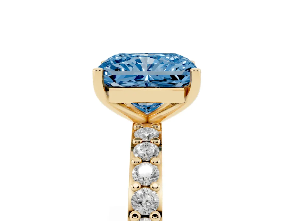 Fancy Blue Radiant Cut Cut Diamond Solitaire with Pave Band and Four-Prong Setting Yellow gold