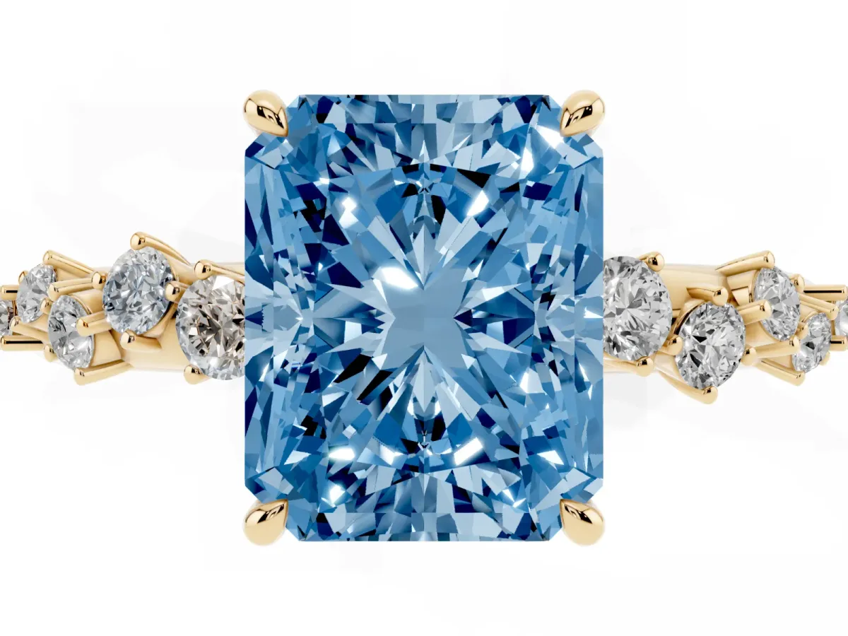 Fancy Blue Radiant Cut Diamond Cluster Side Stone Solitaire Ring with Prong Setting Yellow gold
