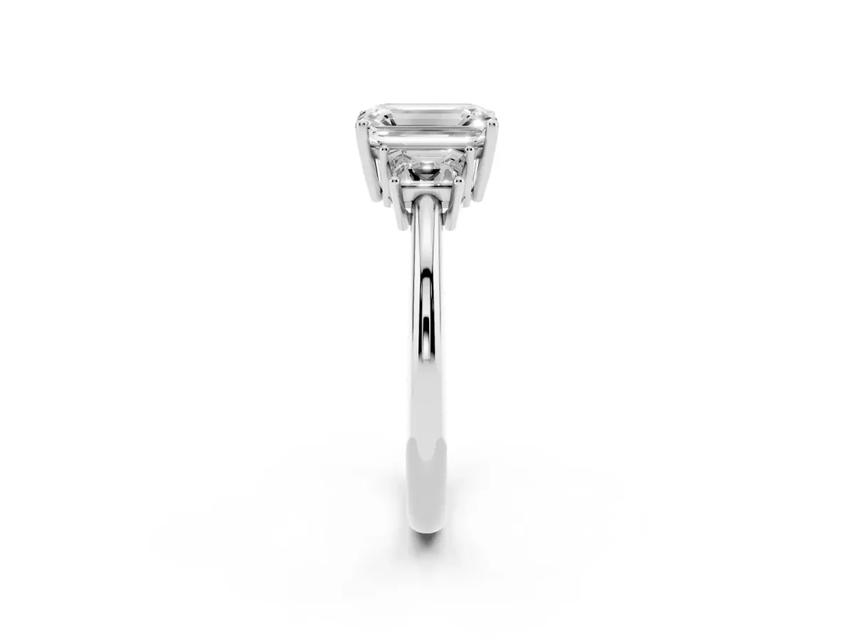 Emerald Cut Diamond Three-Stone Ring with Trapezoid Side Stones and Prong Setting Silver