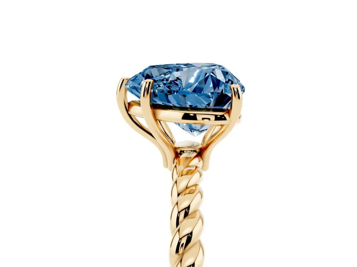 Fancy Blue Heart Cut Solitaire Twist Band Ring with Four-Prong Setting Yellow gold