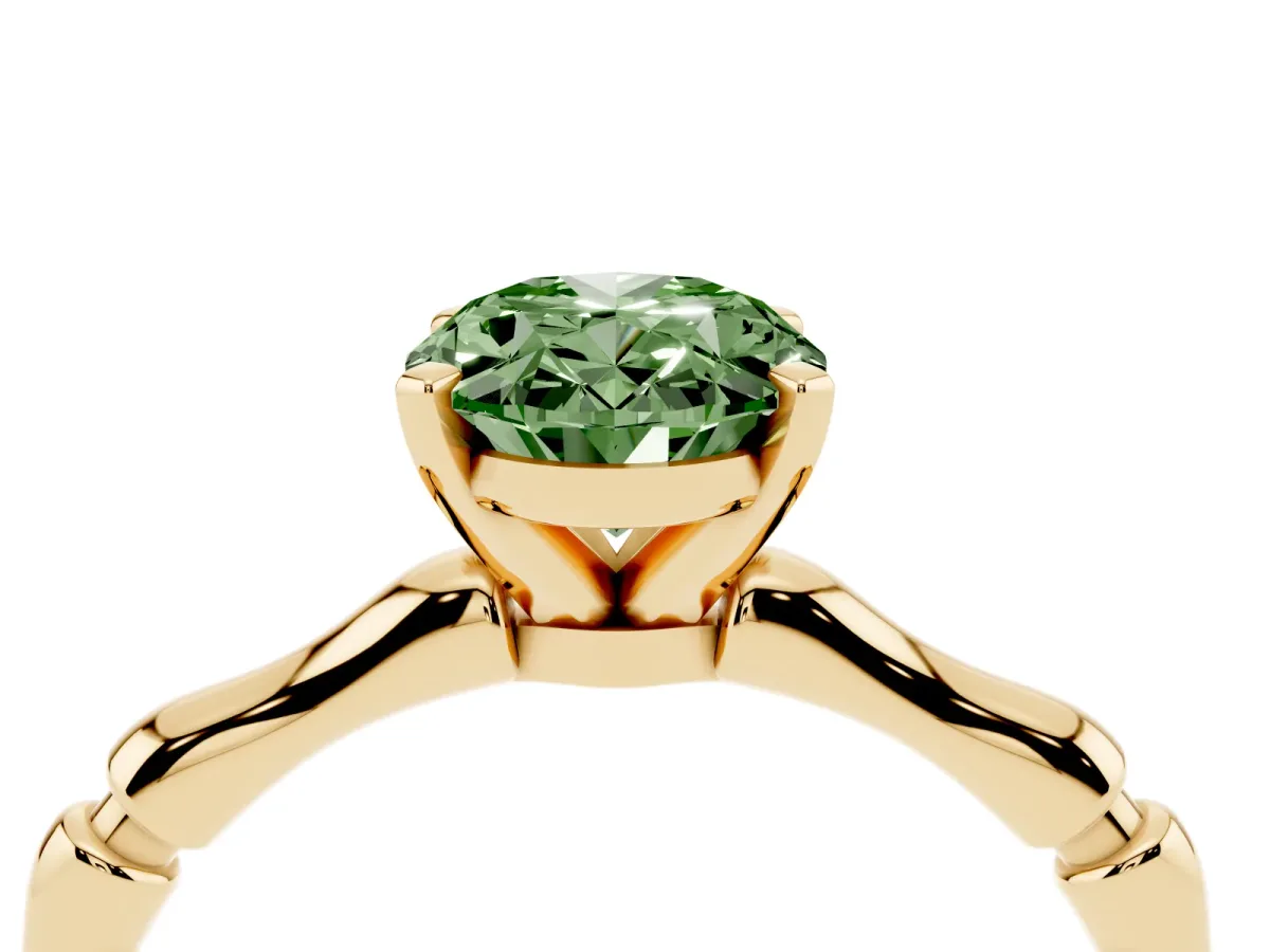 Fancy Green Oval Cut Solitaire Diamond Ring with Bamboo Band and Four-Prong Setting Yellow gold