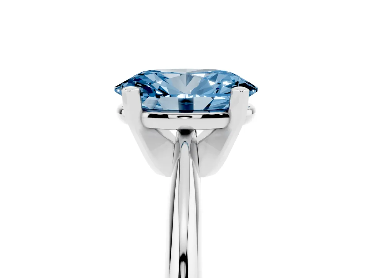 Fancy Blue Oval Cut Cut Solitaire Ring with Four-Prong Setting on a Classic Band Silver