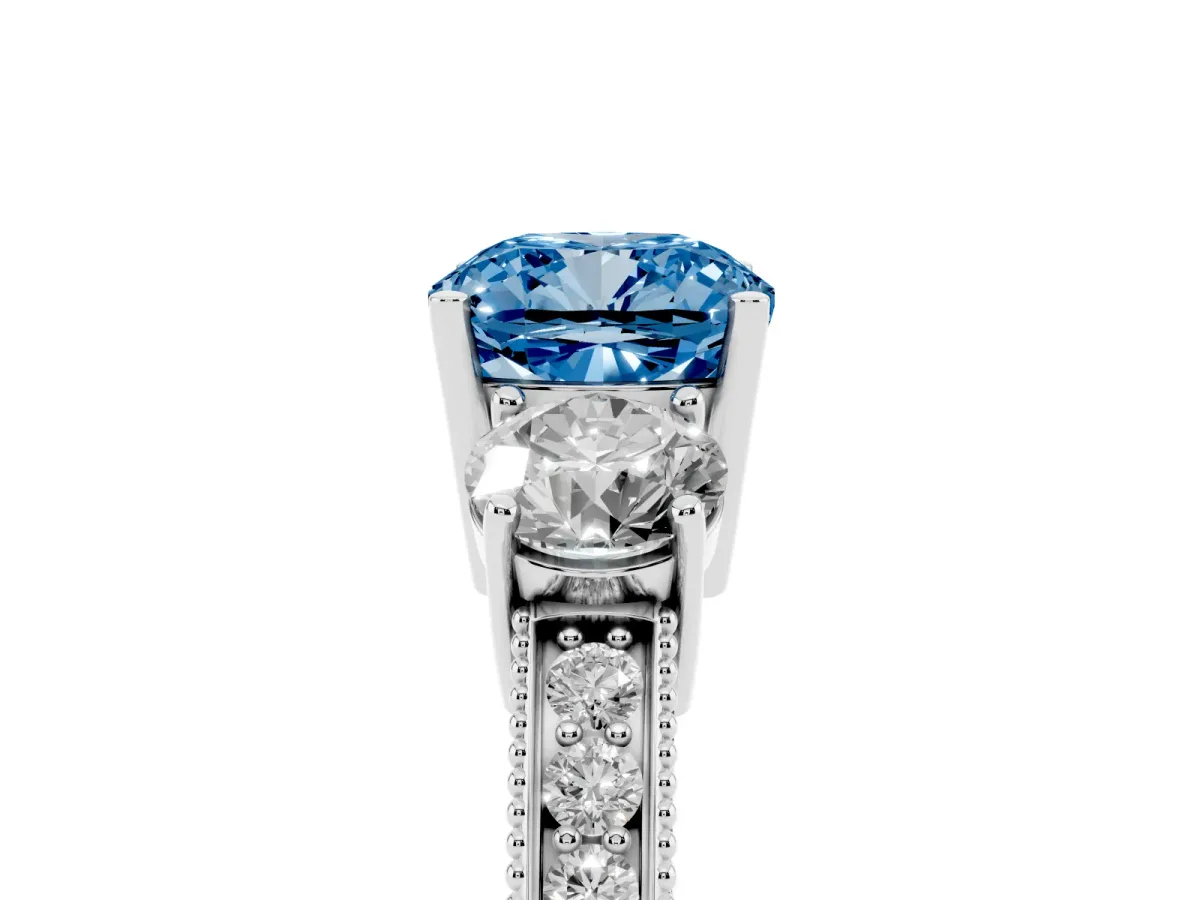 Fancy Blue Cushion Cut Three-Stone Diamond Ring with Pavé Band and Four-Prong Setting Silver