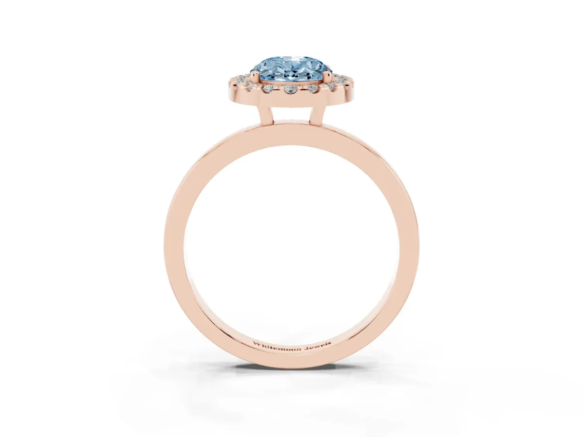 Fancy Blue Oval Cut Halo Diamond Solitaire with Pavé Band and Four-Prong Setting Rose gold