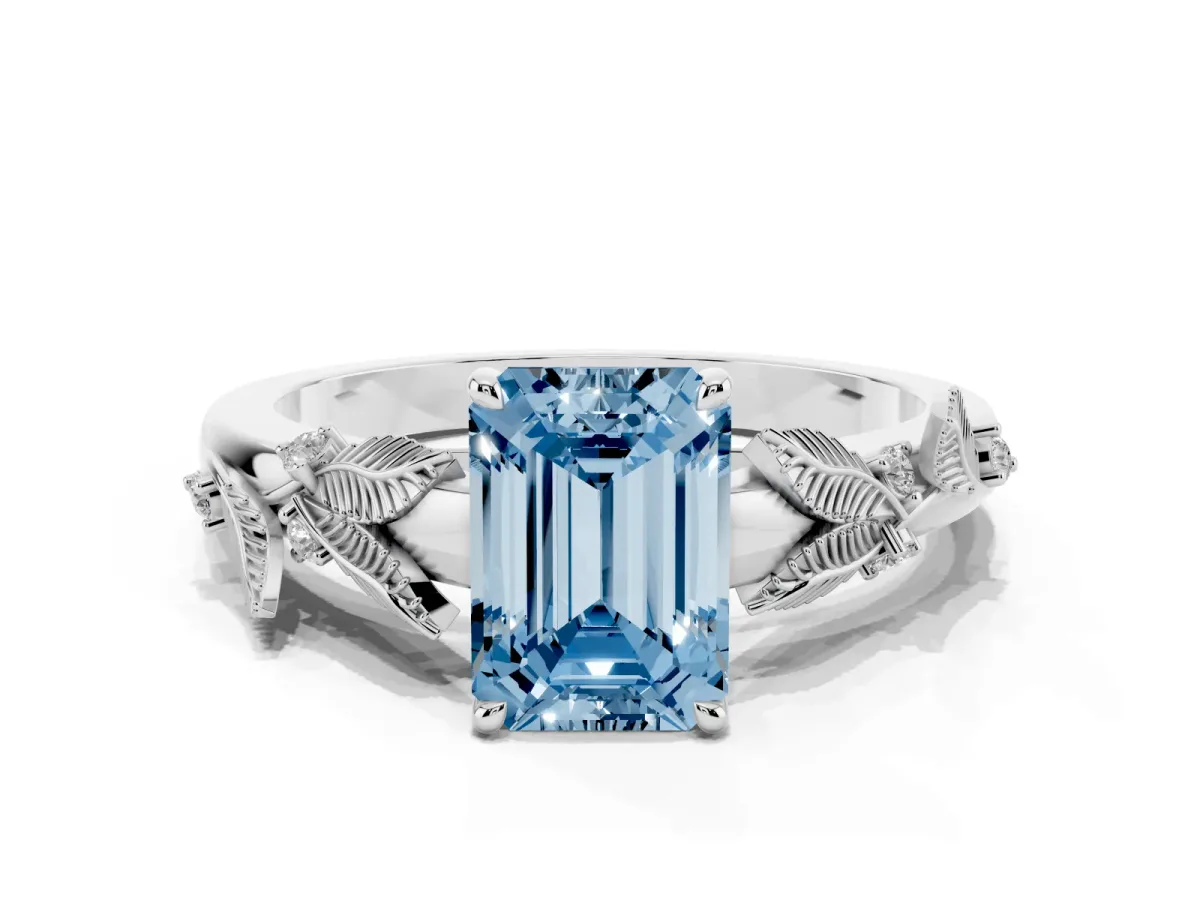 Fancy Blue Emerald Cut Diamond Solitaire Ring with Leaf Motif Band and Four-Prong Setting Silver