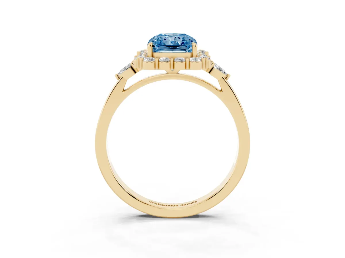 Fancy Blue Radiant Cut Diamond Halo Ring with Pear Side Stones and Prong Setting Yellow gold