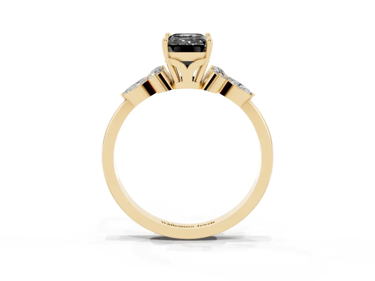 Fancy Black Emerald Cut Brilliant Diamond Solitaire Ring with Pear Side Stones and Four-Prong Setting Yellow gold