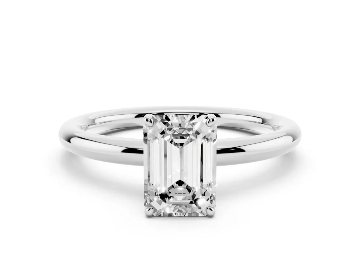 Emerald Cut Solitaire Diamond Ring with Four-Prong Setting on a Plain Band Platinum