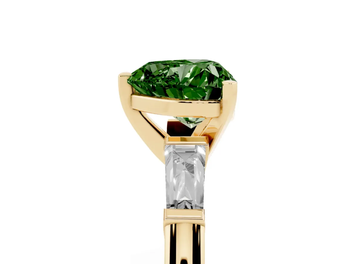 Fancy Green Heart Cut Solitaire with Tapered Baguette Side Stones on a Classic Band with Four-Prong Setting Yellow gold