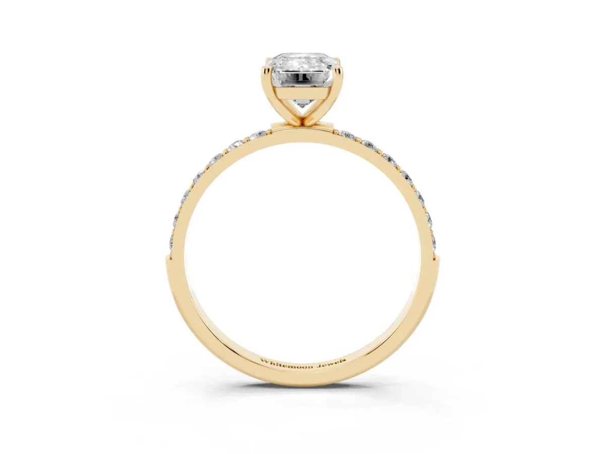 Emerald Cut Diamond Solitaire Ring with Round Pavé Shoulders and Prong Setting Yellow gold