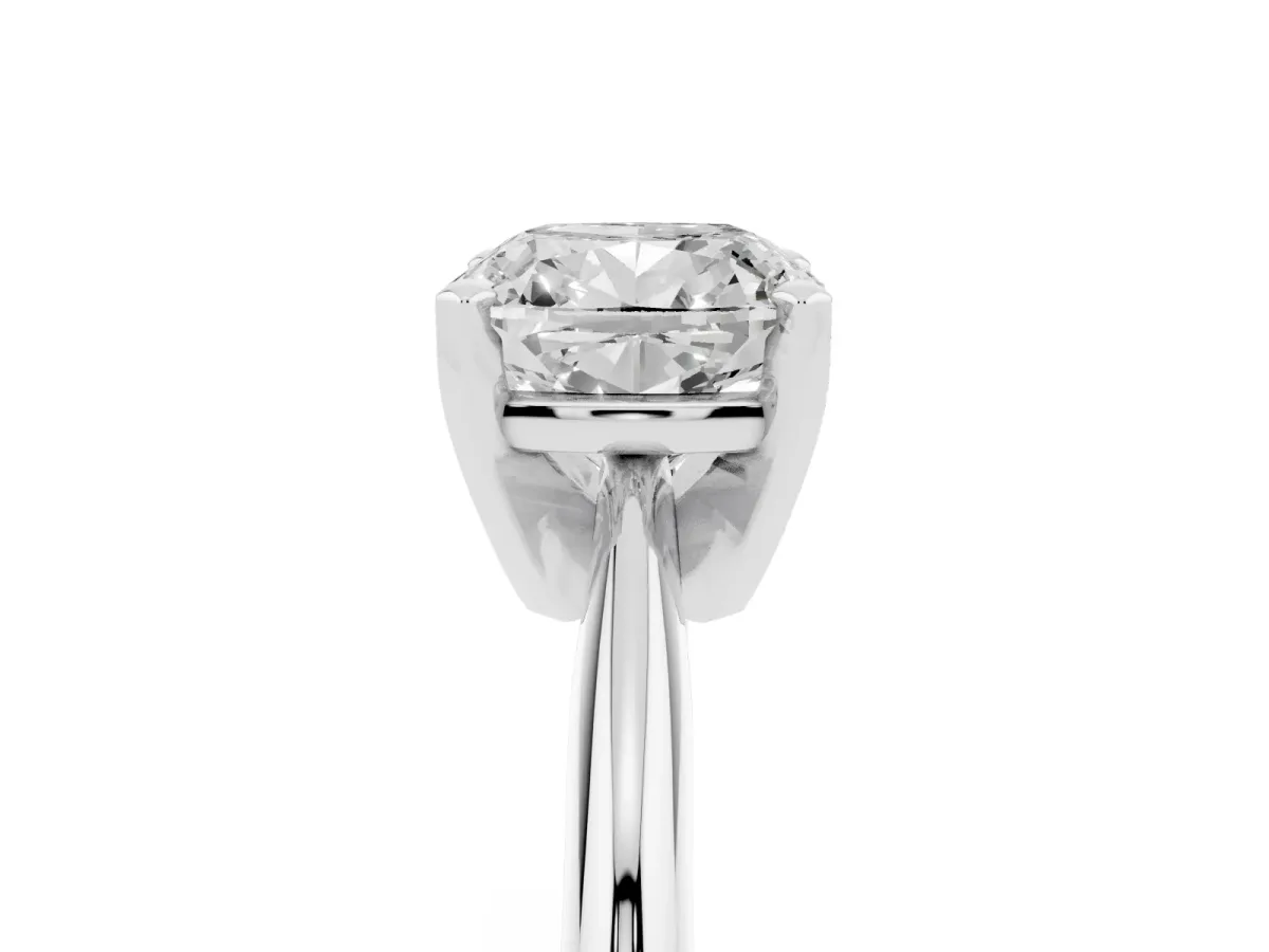 Cushion Cut Cut Solitaire Ring with Four-Prong Setting on a Classic Band Silver
