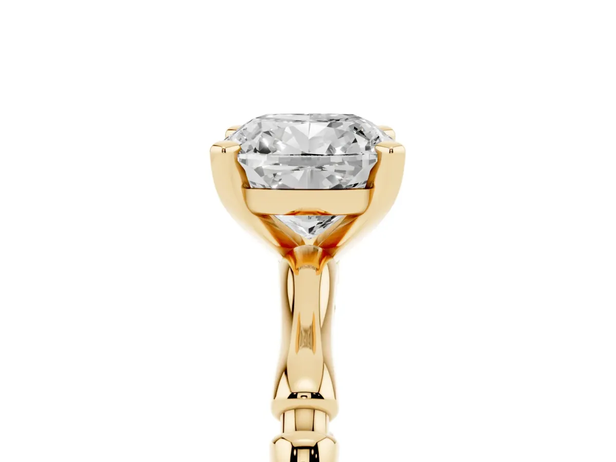 Cushion Cut Solitaire Diamond Ring with Bamboo Band and Four-Prong Setting Yellow gold