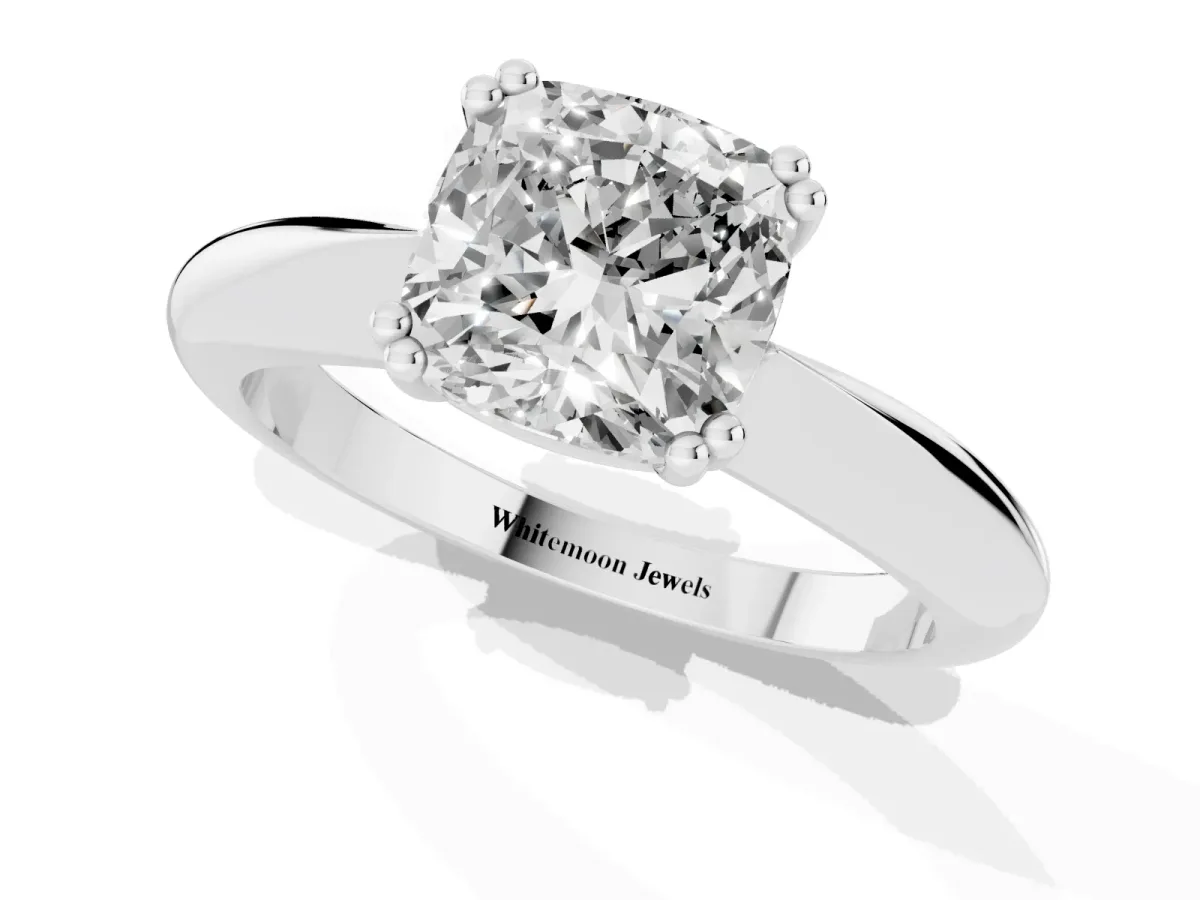 Cushion Cut Cut Solitaire Engagement Ring with Tapered Band and Four-Prong Setting Platinum
