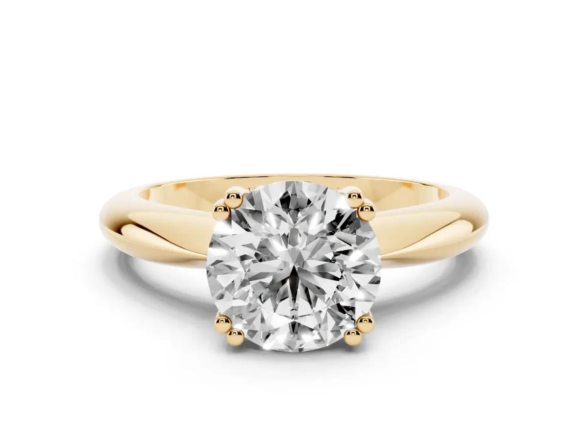 Round Cut Cut Solitaire Engagement Ring with Tapered Band and Four-Prong Setting Yellow gold