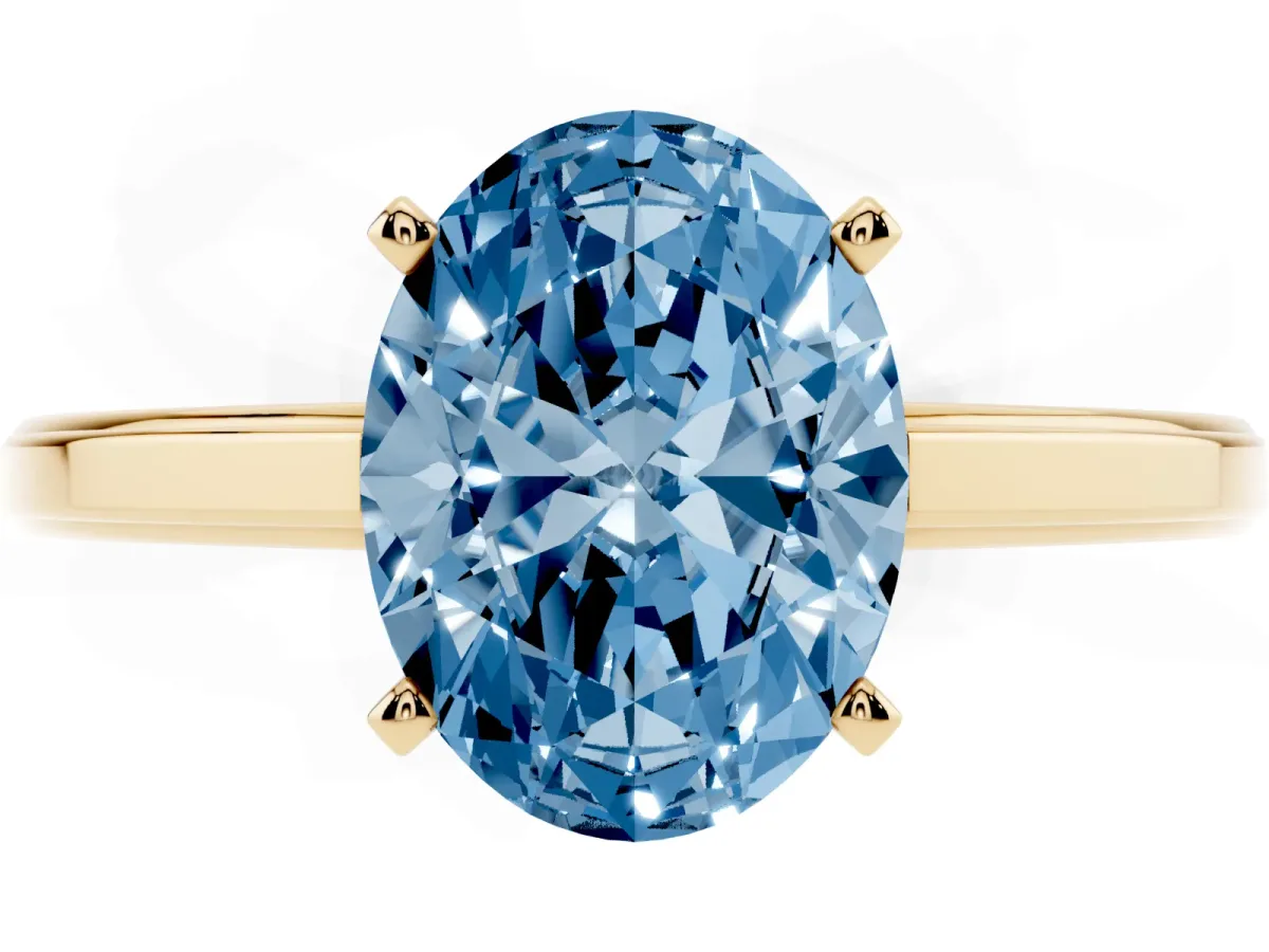Fancy Blue Oval Cut Solitaire Diamond Ring with Four-Prong Setting and Classic Band Yellow gold