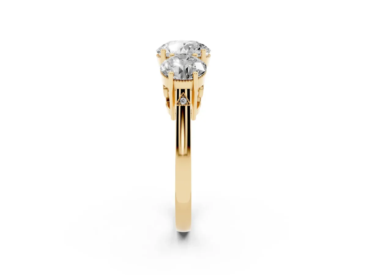 Three-Stone Round Cut Diamond Engagement Ring with Prong Setting on a Classic Band Yellow gold