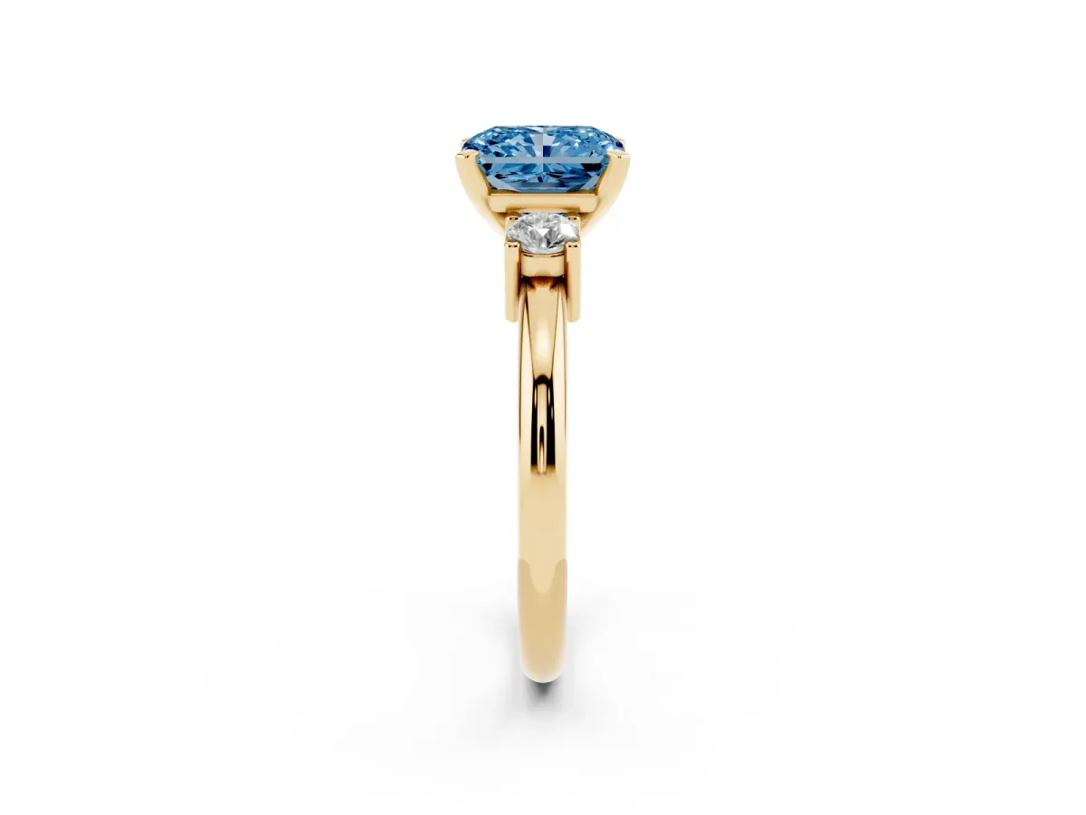 Fancy Blue Three-Stone Radiant Cut Cut Diamond Solitaire with Prong Setting and Classic Band Yellow gold
