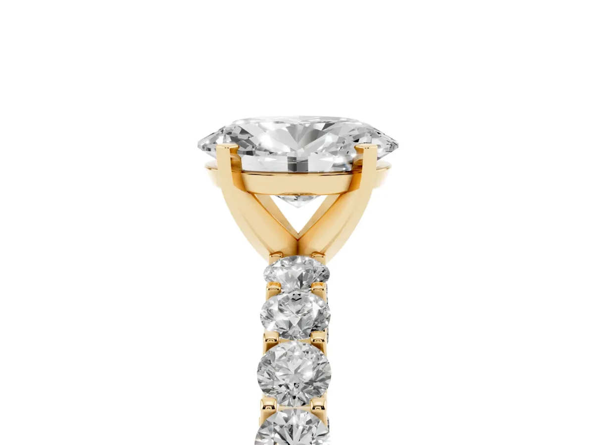 Oval Cut Diamond Solitaire Ring with Shared Prong Pavé Band and Four-Prong Setting Yellow gold