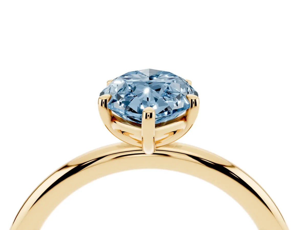 Fancy Blue Marquise Cut Solitaire Diamond Ring with Four-Prong Setting on a Plain Band Yellow gold