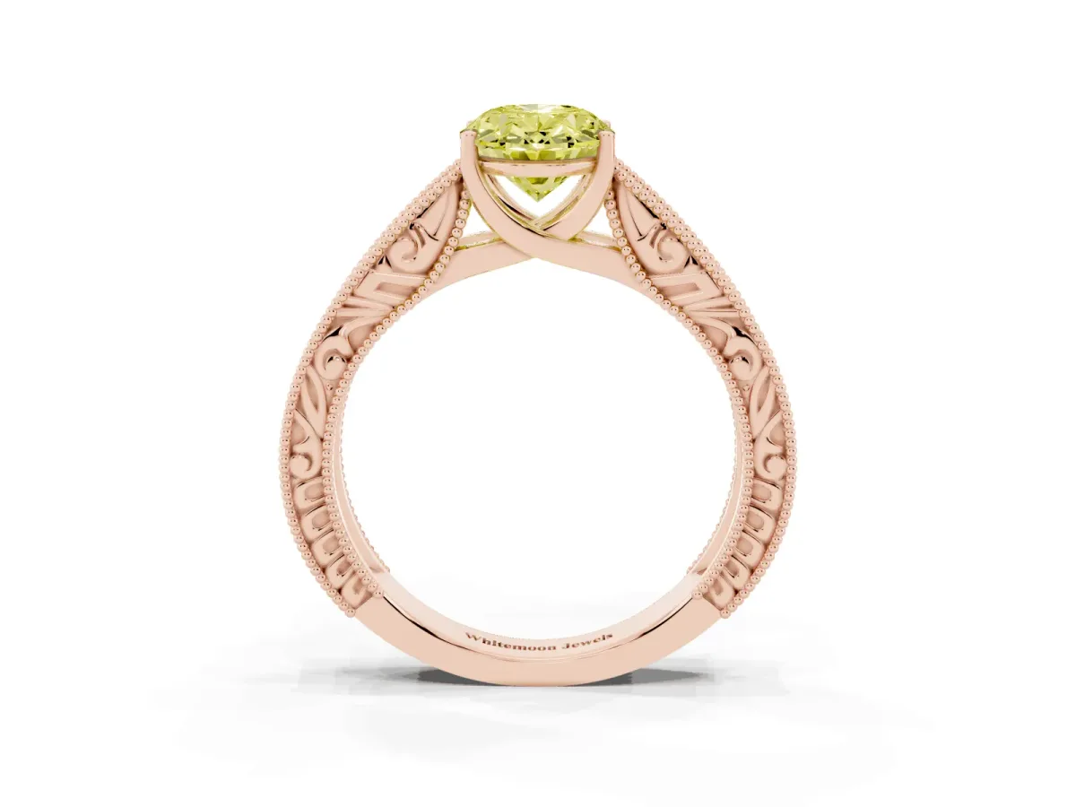 Fancy Yellow Oval Cut Diamond Solitaire Ring with Engraved Band and Four-Prong Setting Rose gold