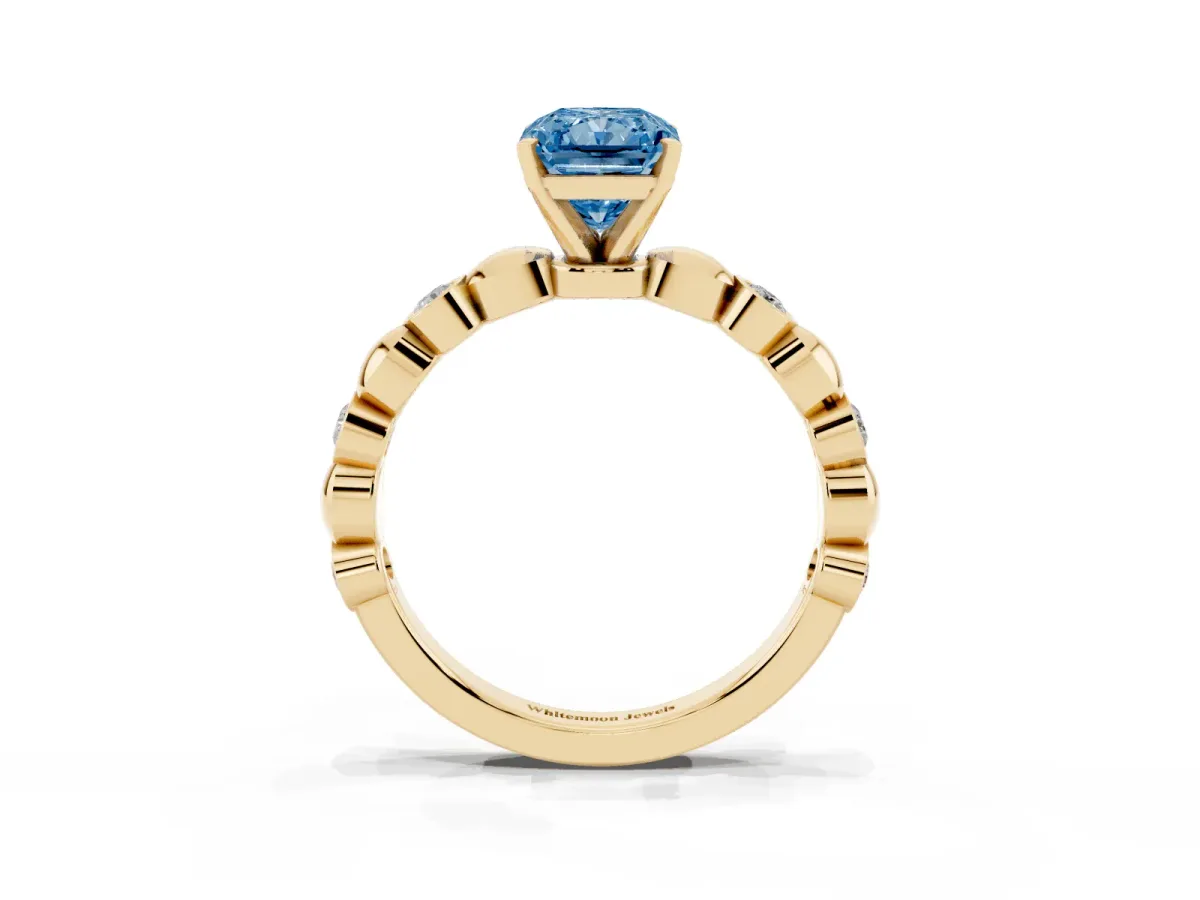 Fancy Blue Radiant Cut Solitaire Bezel-Set Diamond Ring with Beaded Band and Four-Prong Setting Yellow gold