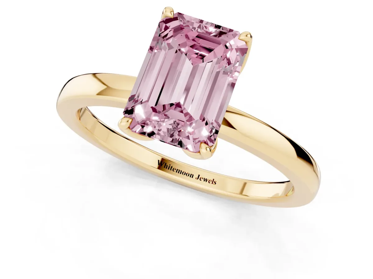Fancy Pink Emerald Cut Diamond Solitaire Ring with Thin Band and Prong Setting Yellow gold