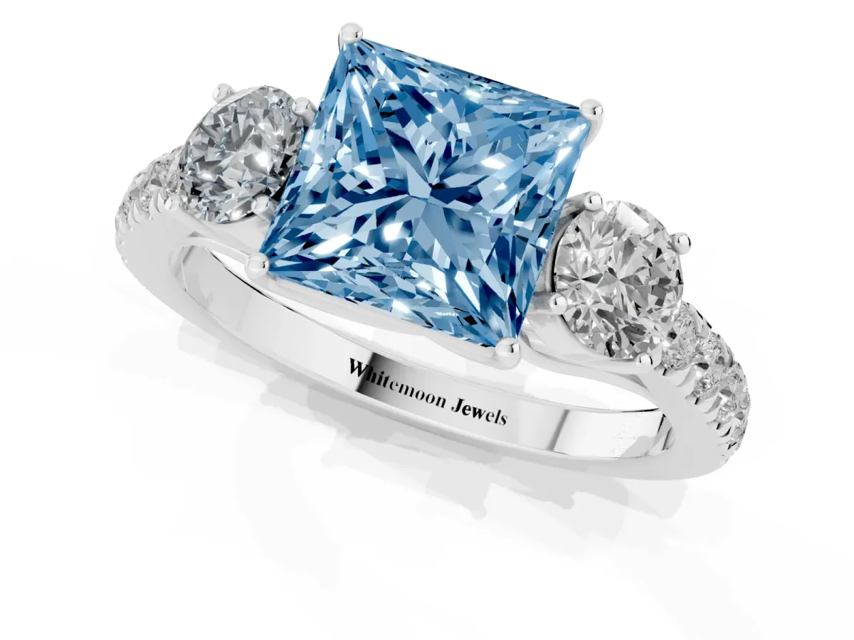 Fancy Blue Princess Cut Cut Diamond Three-Stone Ring with Round Side Stones and Pavé Band Platinum