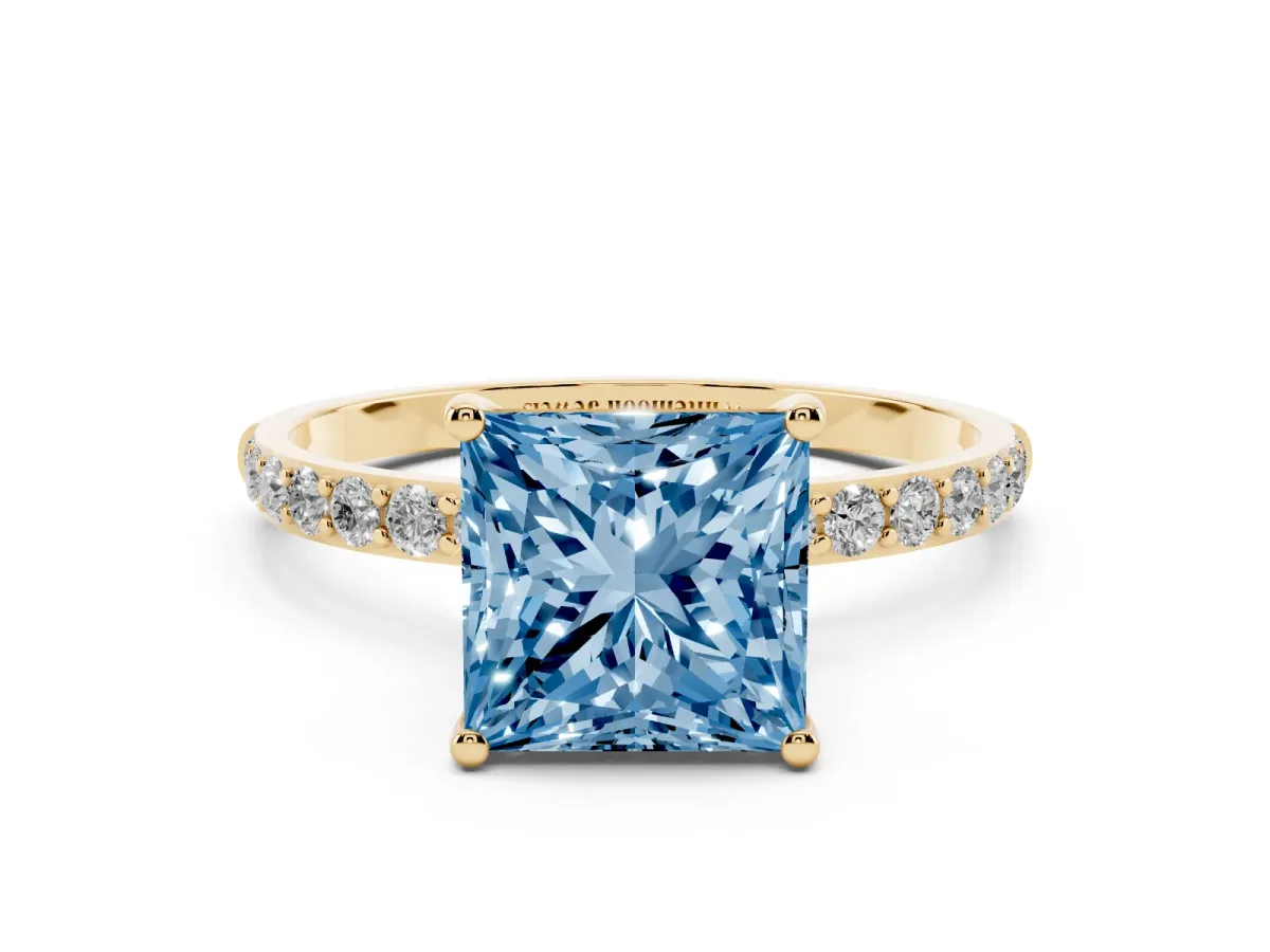Fancy Blue Princess Cut Diamond Solitaire Ring with Round Pavé Shoulders and Prong Setting Yellow gold