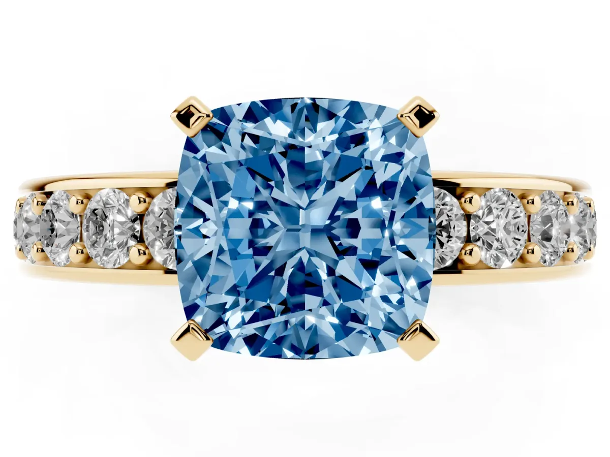 Fancy Blue Cushion Cut Diamond Engagement Ring with Channel Set Round Band and Prong Setting Yellow gold