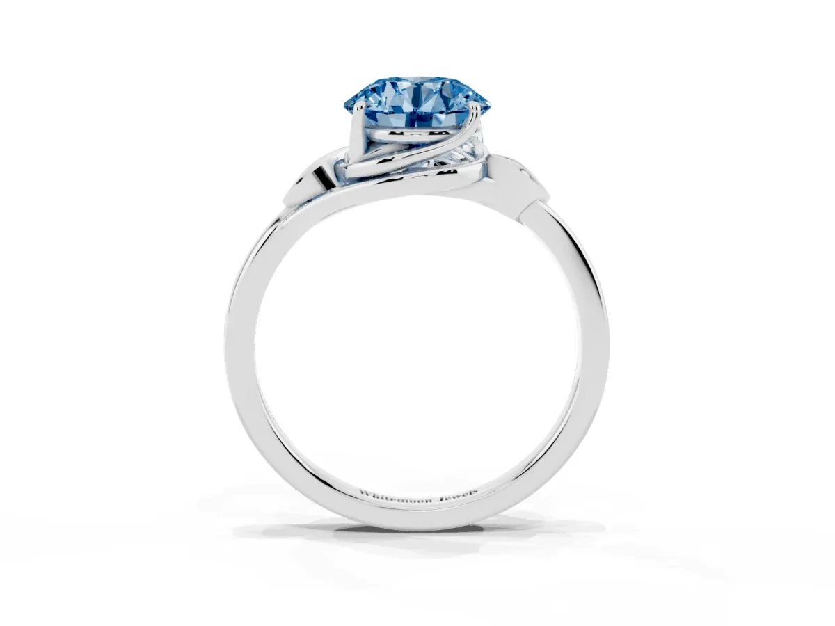 Fancy Blue Round Cut Diamond Solitaire Ring with Twist Band and Four-Prong Setting Silver