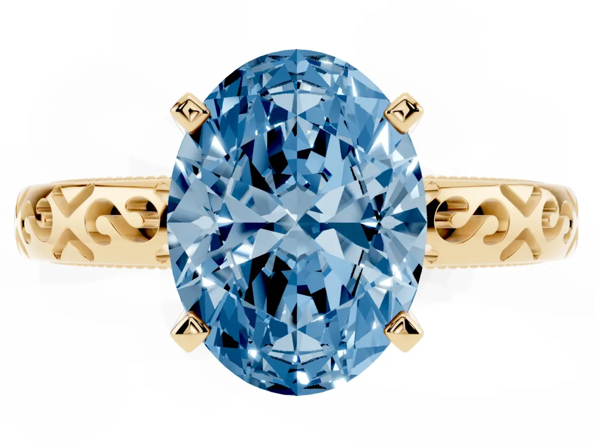 Fancy Blue Oval Cut Solitaire Engagement Ring with Scrollwork Band and Four-Prong Setting Yellow gold