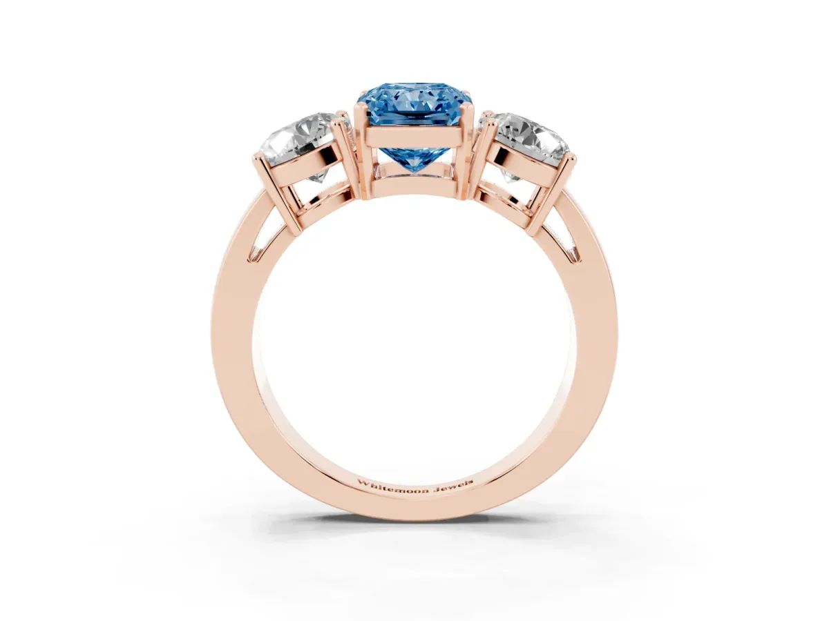 Fancy Blue Three-Stone Radiant Cut Diamond Ring with Round Side Stones, Classic Band, and Four-Prong Setting Rose gold