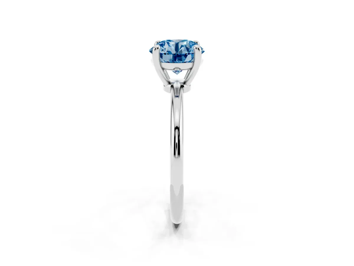 Fancy Blue Round Cut Solitaire Diamond Ring with 4-Prong Setting on a Classic Band Silver