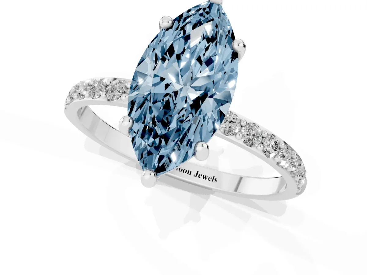 Fancy Blue Marquise Cut Diamond Solitaire Ring with Round Pavé Band and Prong Setting Silver