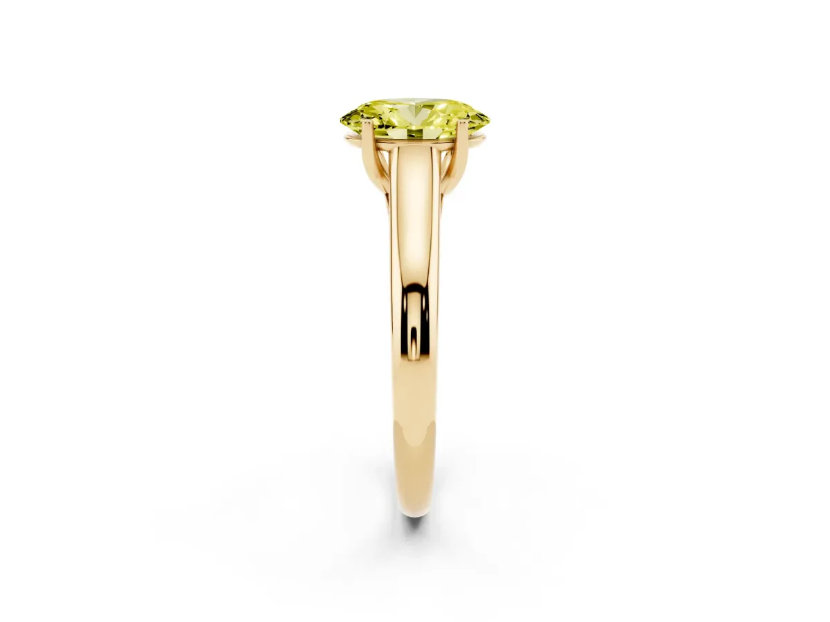 Fancy Yellow Oval Cut Solitaire Engagement Ring with Tapered Band and Four-Prong Setting Yellow gold