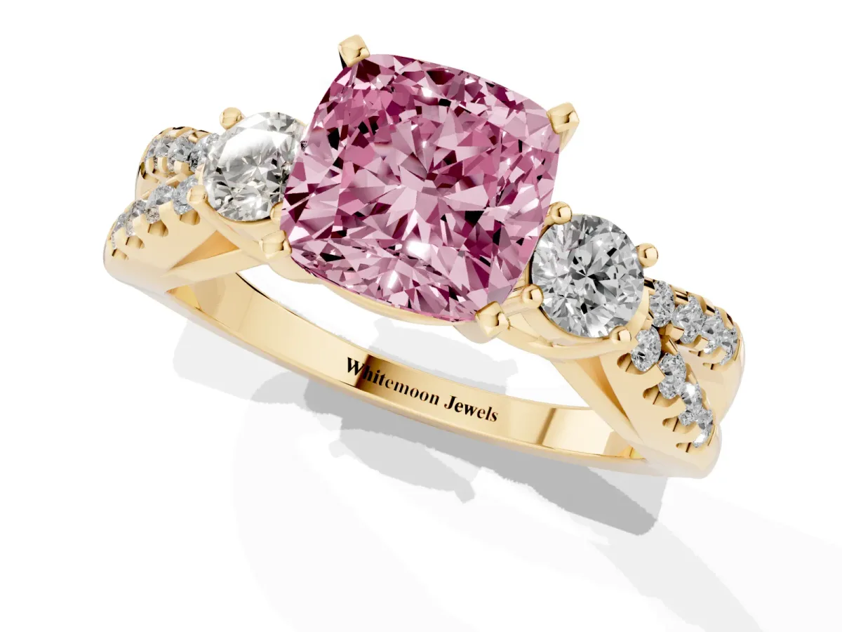 Fancy Pink Cushion Cut Diamond Three-Stone Ring with Pavé Split Shank and Four-Prong Setting Yellow gold