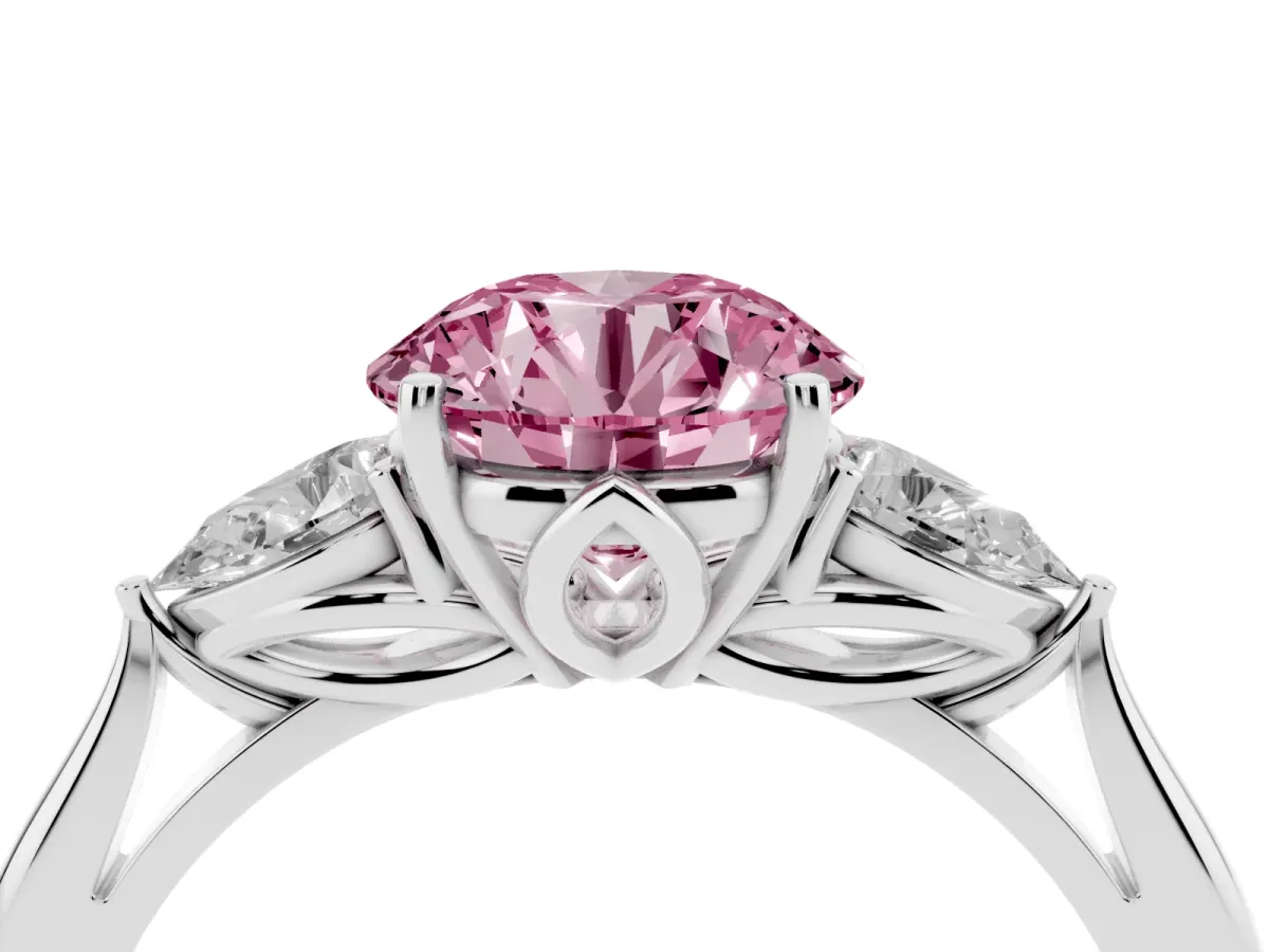 Fancy Pink Three-Stone Round Cut Diamond Ring with Pear Side Stones in Four-Prong Setting Platinum