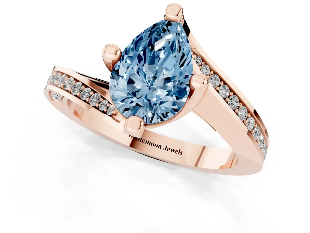 Fancy Blue Pear Cut Solitaire Diamond Twist Band with Pavé Setting and Four-Prong Setting Rose gold