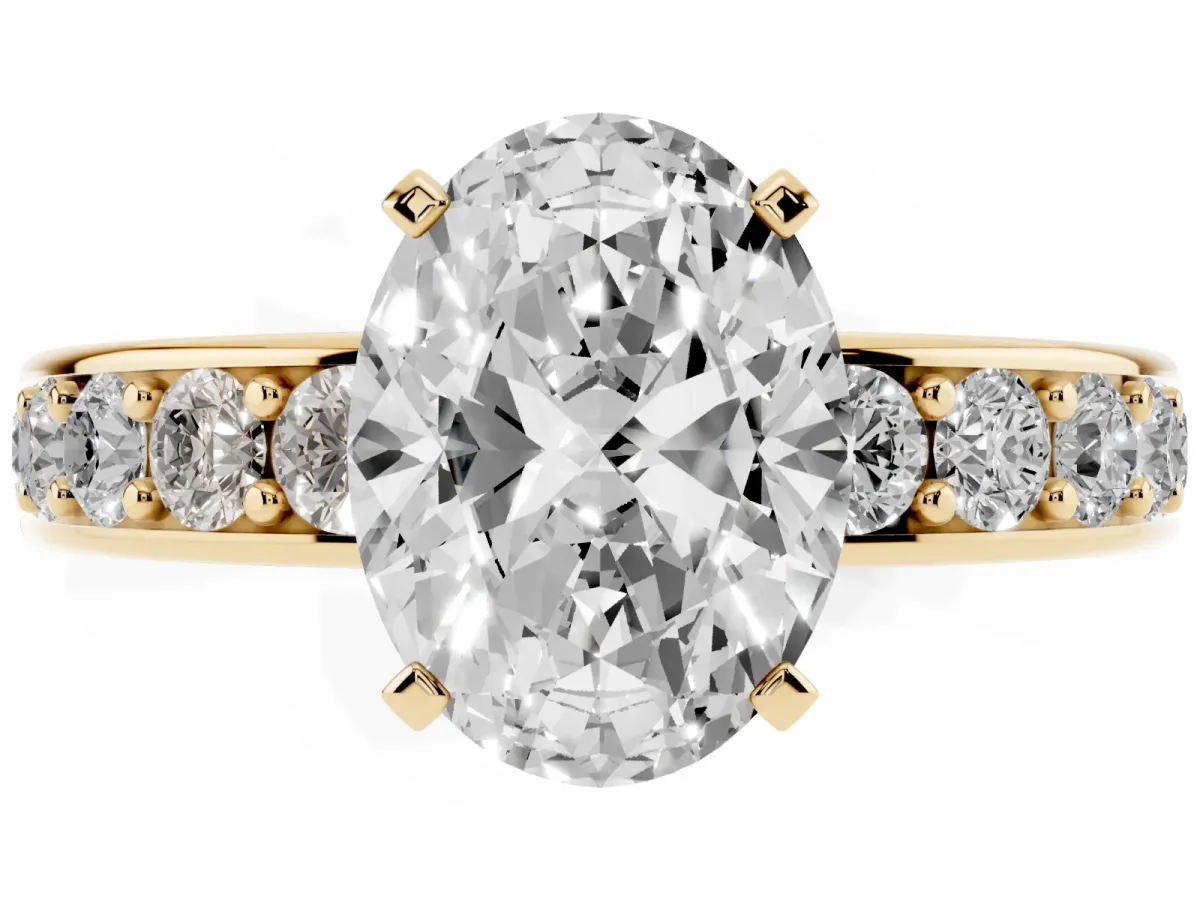 Oval Cut Diamond Engagement Ring with Channel Set Round Band and Prong Setting Yellow gold